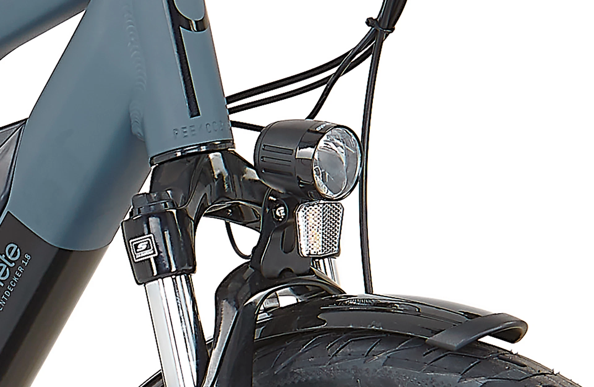 Bildausschnitt Detailansicht Scheinwerfer mit Federgabel im Anschnitt vor weißem Hintergrund