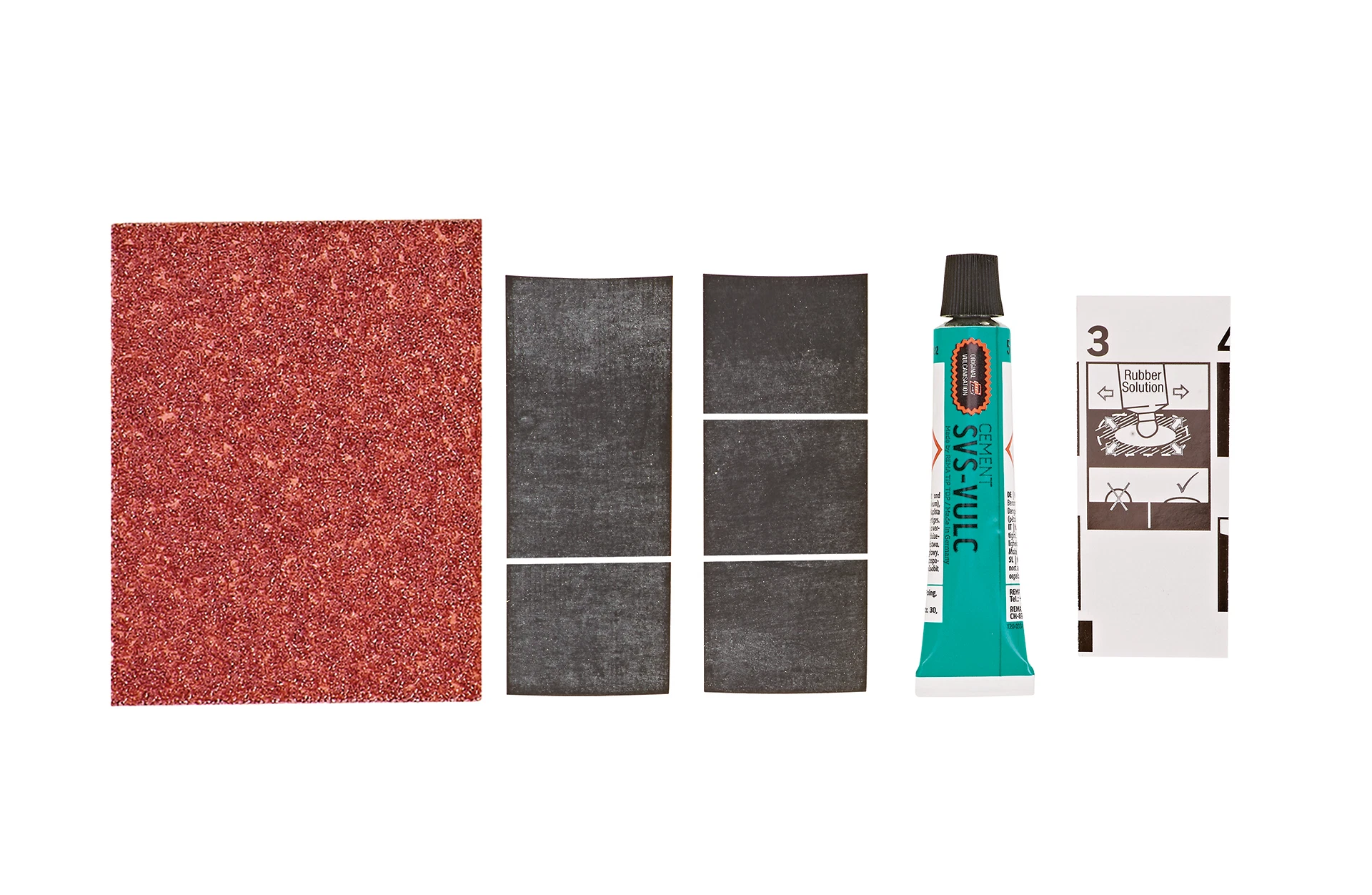 Fahrradflickset Lieferumfang - Ansicht von oben auf weißem Grund