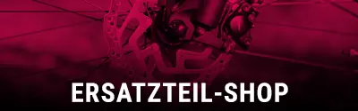 Ersatzteil-Shop Banner mit Fahrrad-Komponenten im Hintergrund und dem Schriftzug ‚Ersatzteil-Shop‘