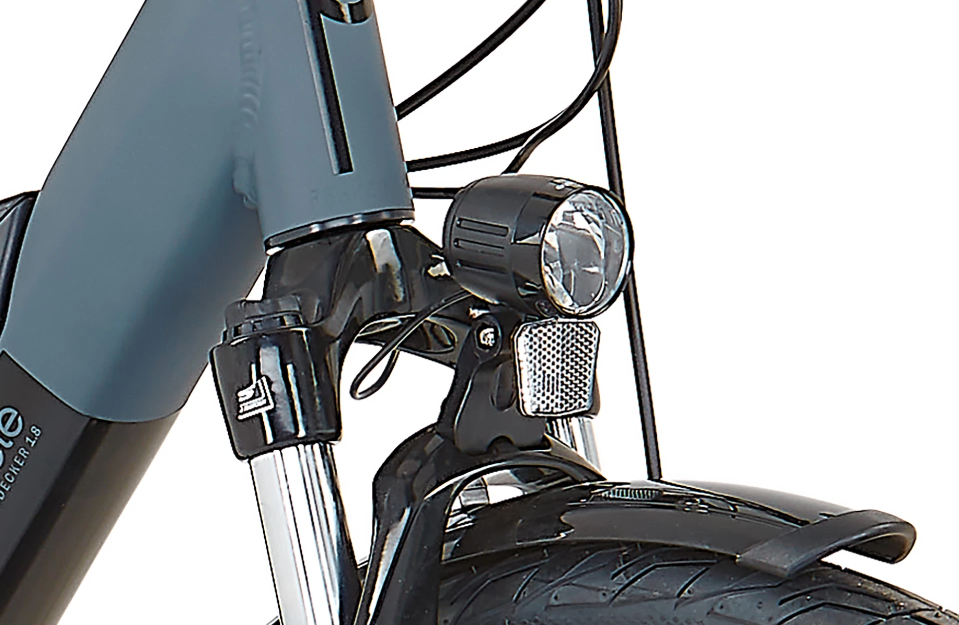 Bildausschnitt Detailansicht Scheinwerfer mit Federgabel im Anschnitt vor weißem Hintergrund